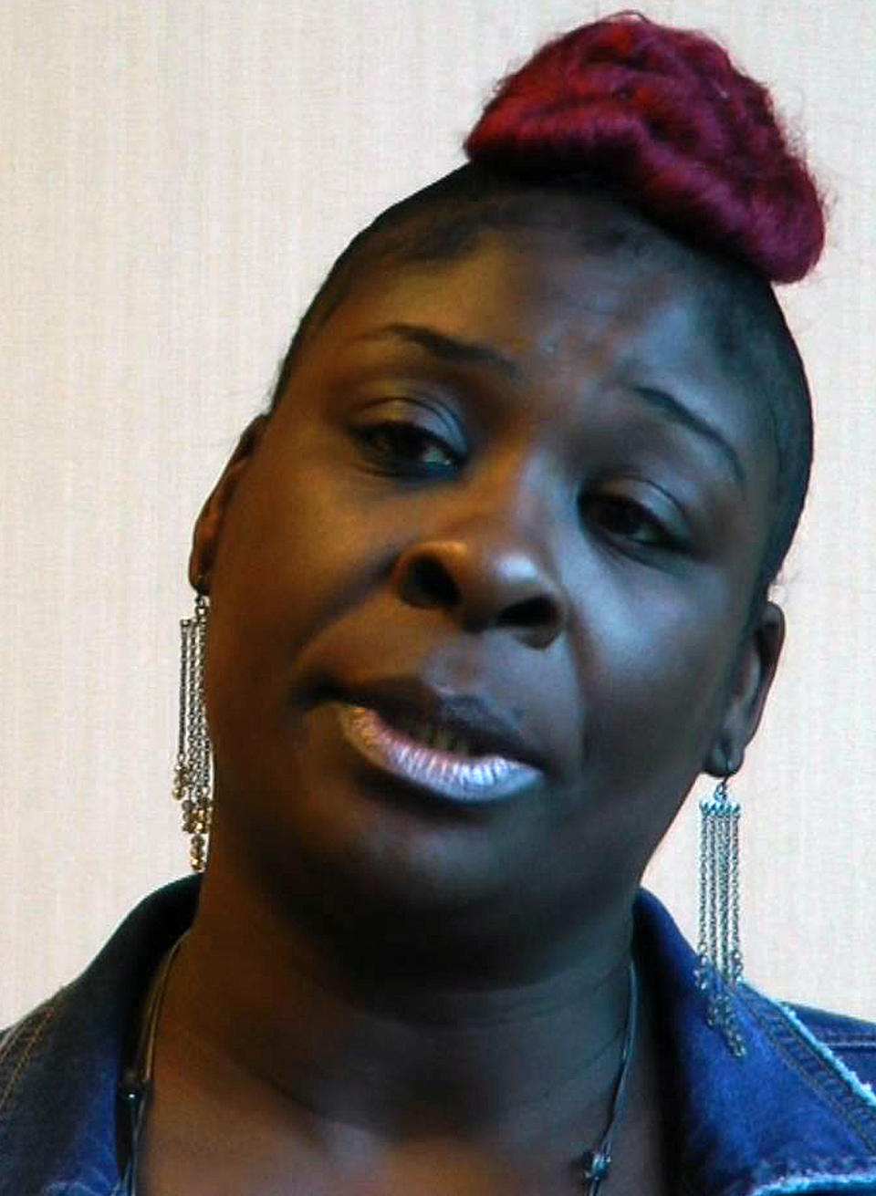 In this still image taken from video, April Pipkins, mother of the late Emantic "EJ" Bradford Jr., speaks during an interview in Birmingham, Ala., on Tuesday, Nov. 27, 2018. Bradford was shot to death by a police officer in a shopping mall on Thanksgiving night, and Pipkins said she believes her son would still be alive had he been white. (AP Photo/Jay Reeves)