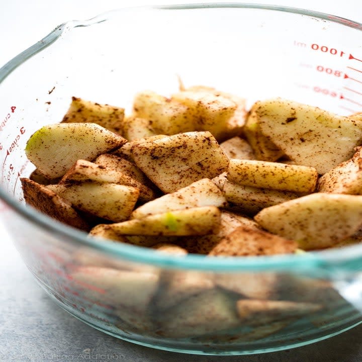 Cinnamon apples in a measuring cup