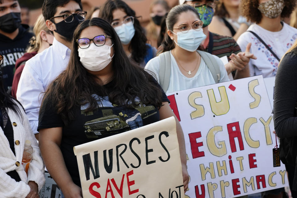 Students for Socialism protest on campus demanding that Kyle Rittenhouse not be allowed to enroll at Arizona State University, Wednesday, Dec. 1, 2021, at ASU in Tempe, Ariz. Protesters were demanding the university disavow the 18-year-old, who was acquitted of murder last month in the deadly shootings during last year's unrest in Kenosha. (AP Photo/Matt York)