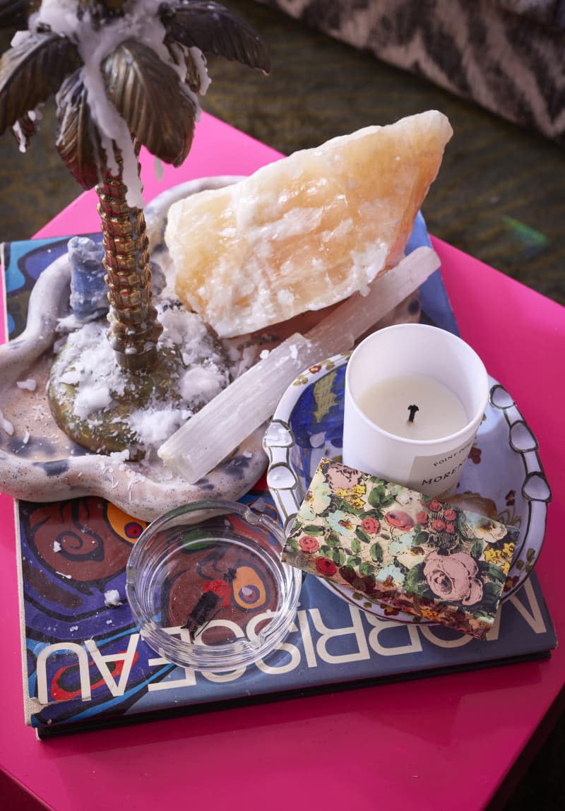 Crystals and candles on coffee table.