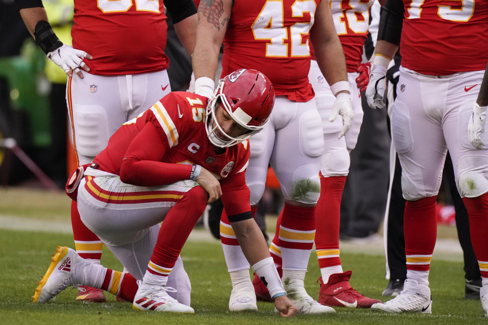 Kansas City Chiefs quarterback Patrick Mahomes kneels on the field after getting injured during the second half against the Browns. (AP Photo/Charlie Riedel)