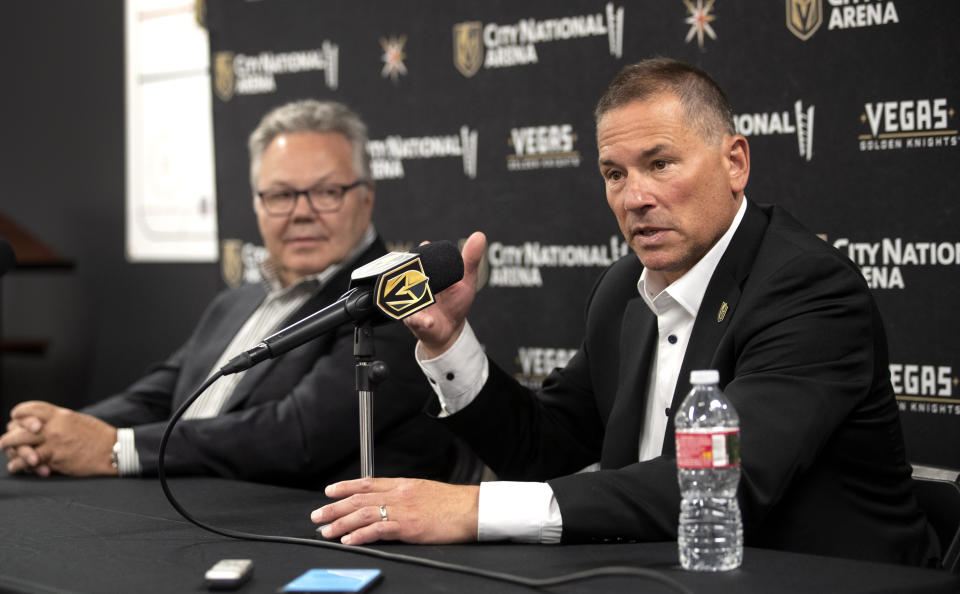 Bruce Cassidy, right, new head coach of the Vegas Golden Knights, responds to a question during an NHL hockey news conference at City National Arena in Las Vegas, Thursday, June 16, 2022. At left is general manager Kelly McCrimmon. (Steve Marcus/Las Vegas Sun via AP)