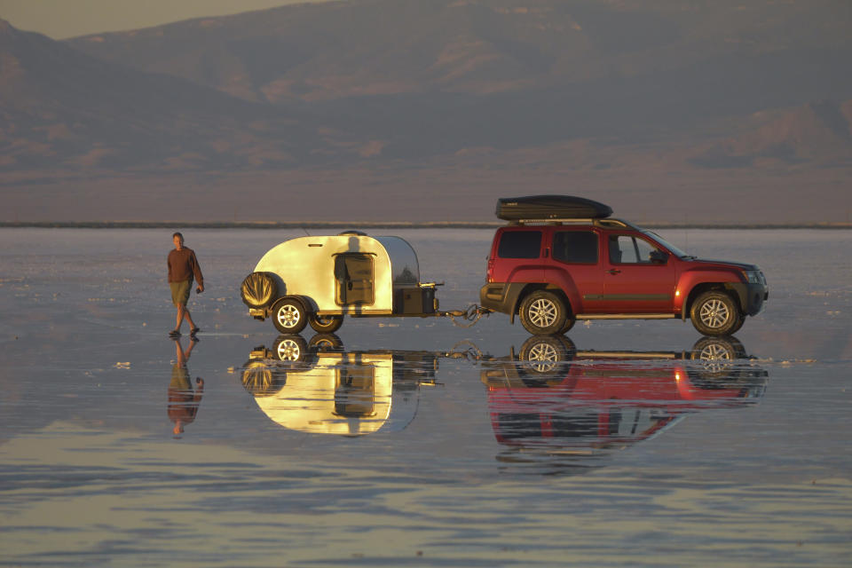 Visitors watch sunrise at the Bonneville Salt Flats on Monday, Sept. 19, 2022, near Wendover, Utah. (AP Photo/Rick Bowmer)