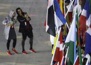 <p>Athletes take a photo in the rain during the closing ceremony in the Maracana stadium at the 2016 Summer Olympics in Rio de Janeiro, Brazil, Sunday, Aug. 21, 2016. (AP Photo/Charlie Riedel) </p>