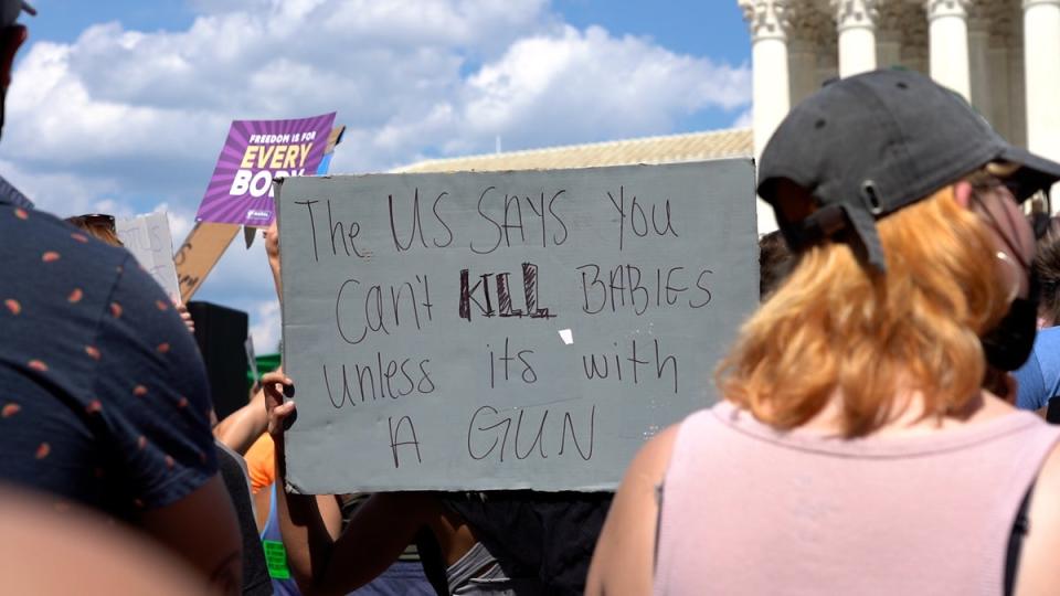 Hundreds gathered outside the Supreme Court following the historic ruling (Julia Saqui/The Independent)