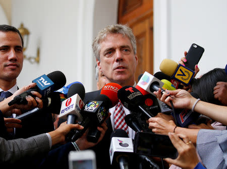 FILE PHOTO: German ambassador to Venezuela Daniel Martin Kriener delivers a news conference next to Venezuelan opposition leader Juan Guaido, who many nations have recognized as the country's rightful interim ruler, and accredited diplomatic representatives of the European Union in Caracas, Venezuela February 19, 2019. REUTERS/Marco Bello/File Photo