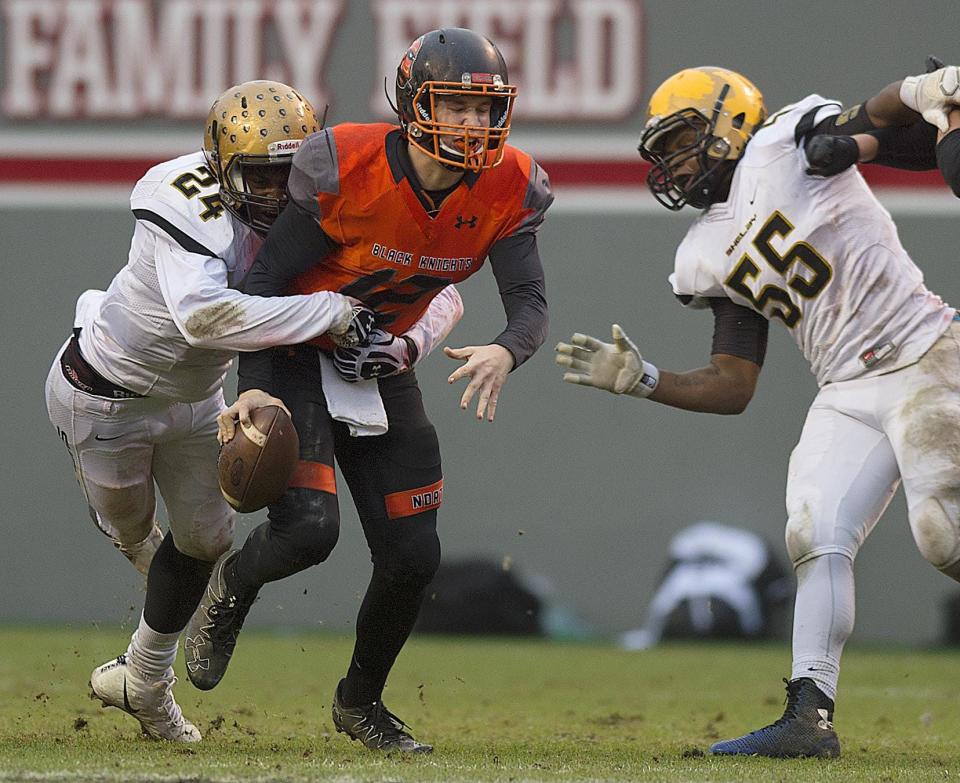 Shelby's Malaki Hamrick sacks North Davidson quarterback Landon Moore in the 2-AA state championship game in Raleigh on Saturday.