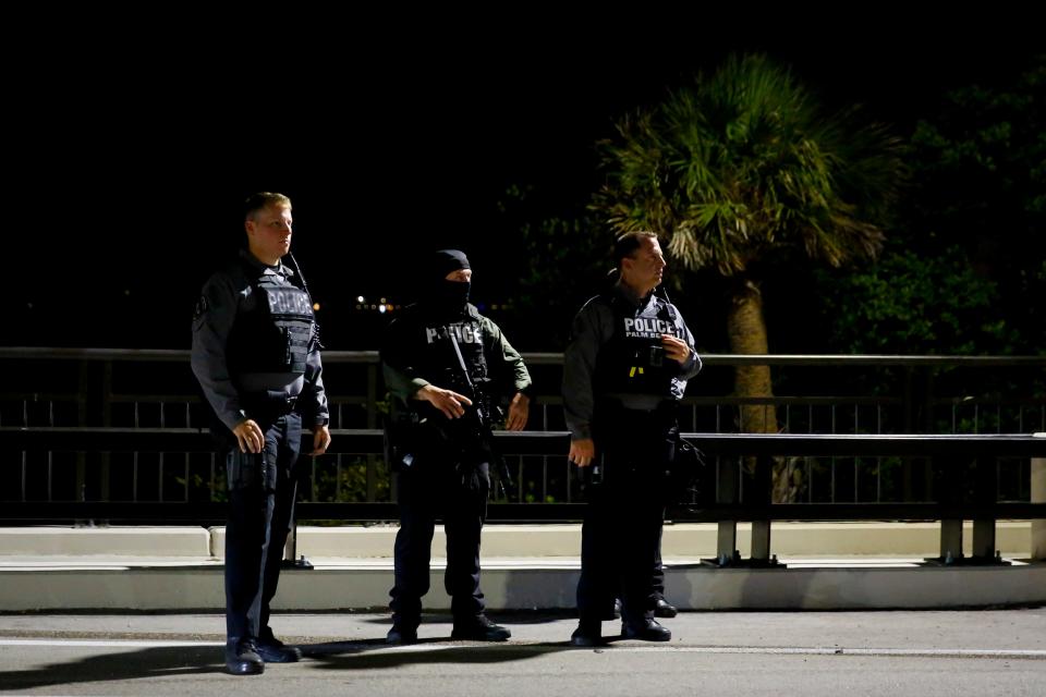 Police officers keep watch near the home of former President Donald Trump at Mar-A-Lago on Aug. 8, 2022, in Palm Beach.