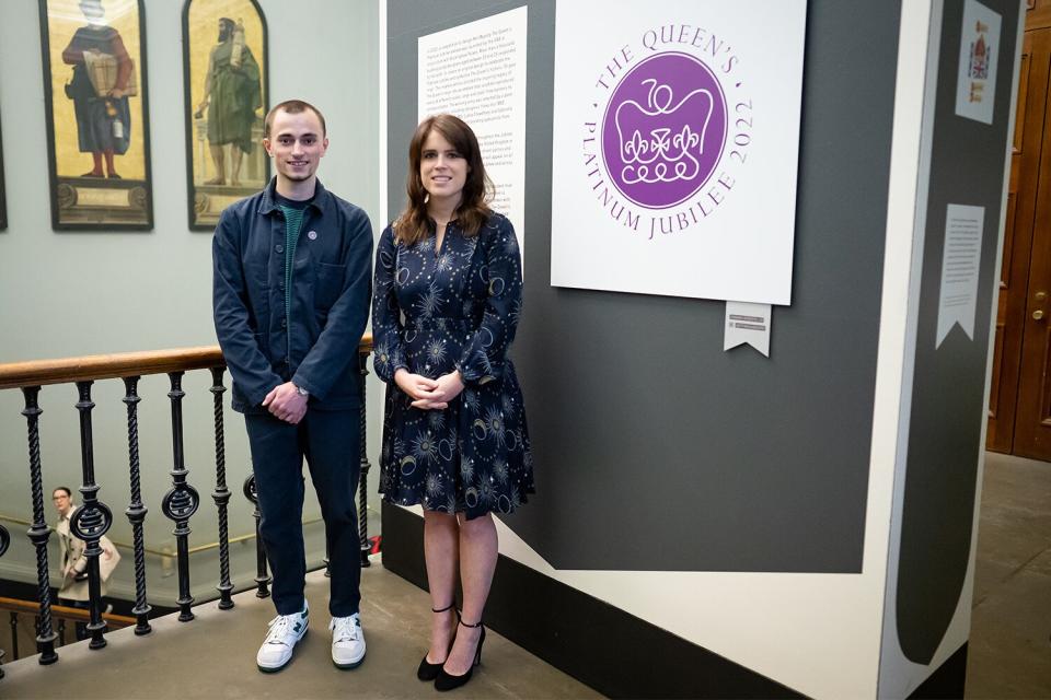 Princess Eugenie and emblem winning design creator Edward Roberts 19 during a visit to view the Queen's Jubilee Emblem Display at the V&amp;A Museum, London. Picture date: Wednesday June 1, 2022.