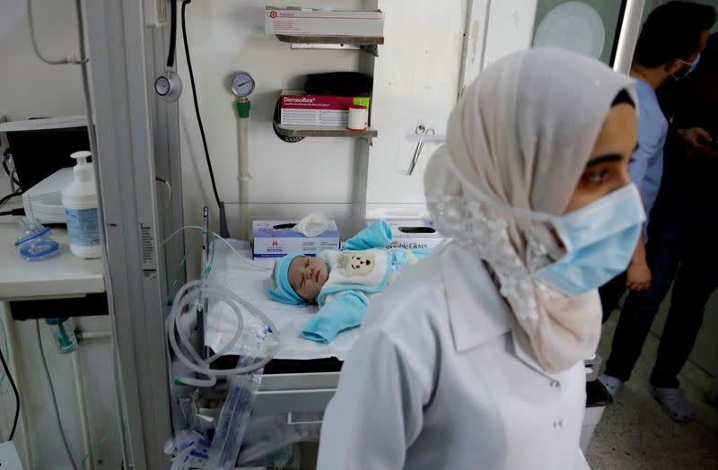 A nurse works at a maternity hospital in Idlib