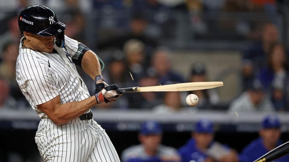  New York Yankees designated hitter Giancarlo Stanton (27) breaks a bat on a pitch against the Kansas City Royals in the first inning during game two of the ALDS for the 2024 MLB Playoffs at Yankee Stadium. 