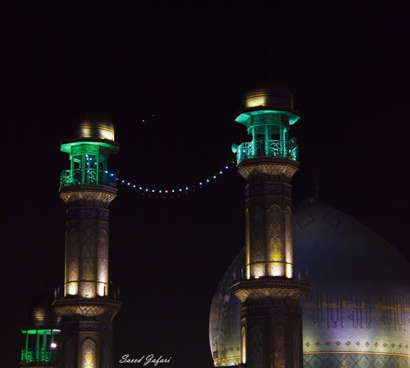 A close encounter between Venus and Jupiter, with the Rasulullah Mosque in Tehran, Iran, in the foreground.