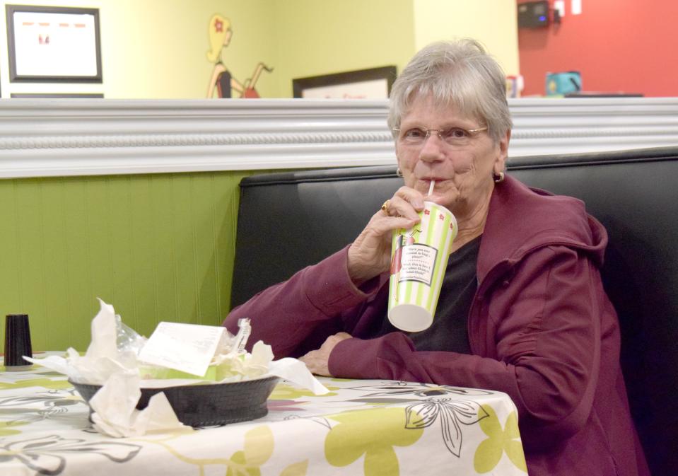 Ada Parish, a Panama City resident, eats dinner on Thursday at the Chicken Salad Chick in Panama City. The business continues to grapple with challenges caused by the COVID-19 pandemic.