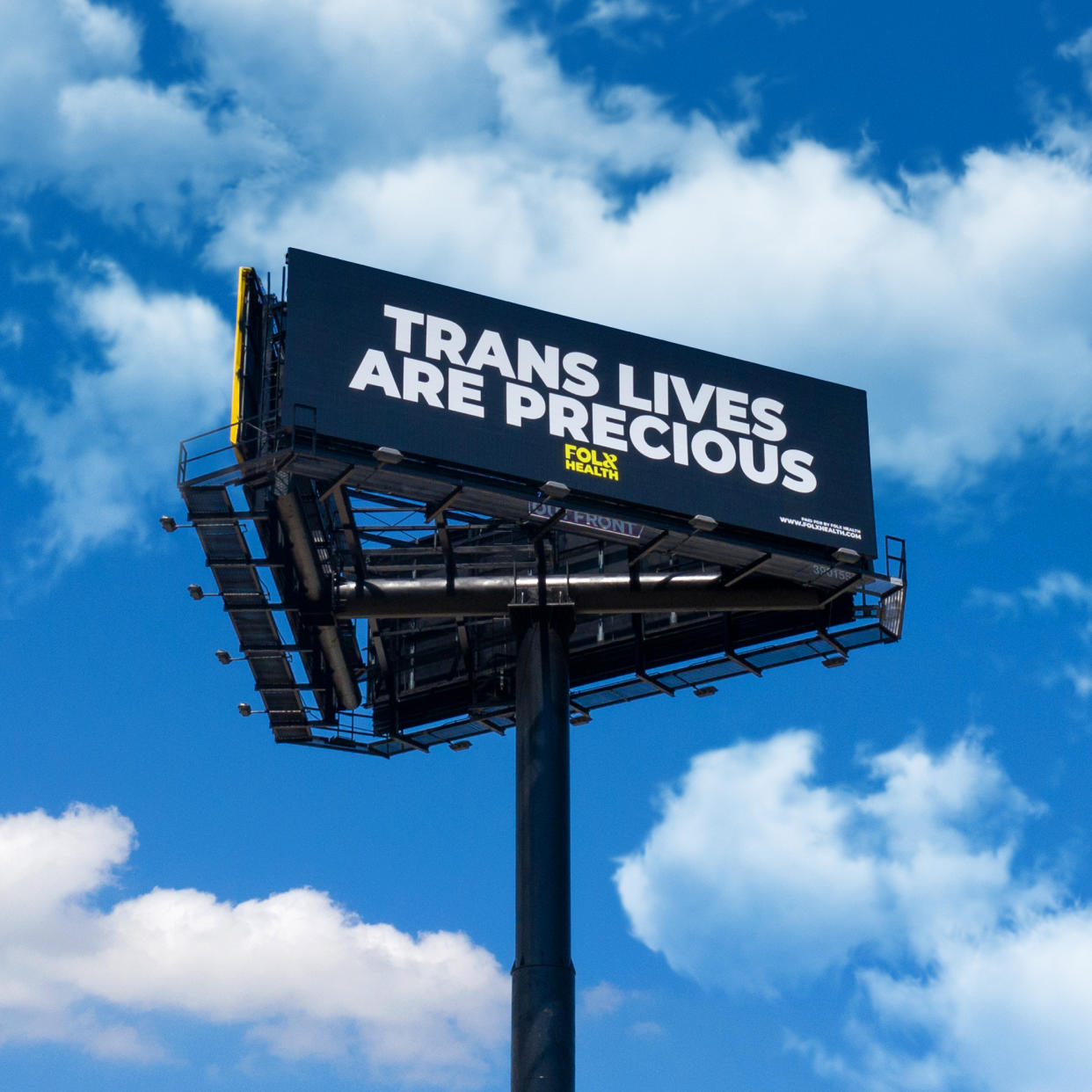 A new telehealth company serving the LGBTQ community launched a Florida billboard campaign that reads “Trans Lives Are Precious” as a message to former President Donald Trump. (Folx Health)