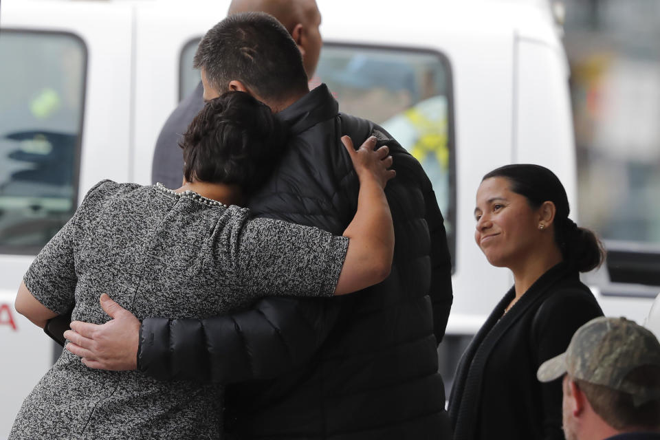 New Orleans Mayor Latoya Cantrell comforts the brother of one of the deceased construction workers near the Hard Rock Hotel, Thursday, Oct. 17, 2019, in New Orleans. The 18-story hotel project that was under construction collapsed last Saturday, killing three workers. Two bodies remain in the wreckage. (AP Photo/Gerald Herbert)