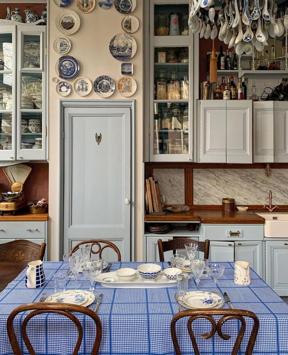 a kitchen with a table and chairs