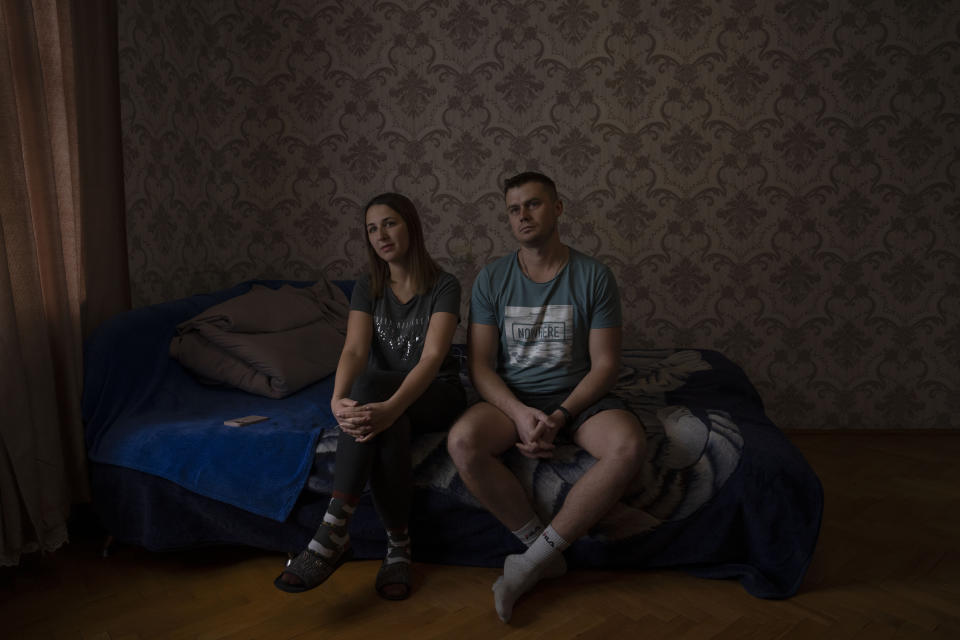 Olya Shlapak, and her husband Sasha Olexandre, recount their story after fleeing their home in Kharkiv, at an apartment they took refuge in and are renting in Lviv, western Ukraine, Sunday, April 3, 2022. The family stayed homeless for seven days, as they sought refuge in a subway, along with hundreds of other residents. Olya recalls the "biggest fear of my life," awakening her daughter to tell her the war had started. (AP Photo/Nariman El-Mofty)