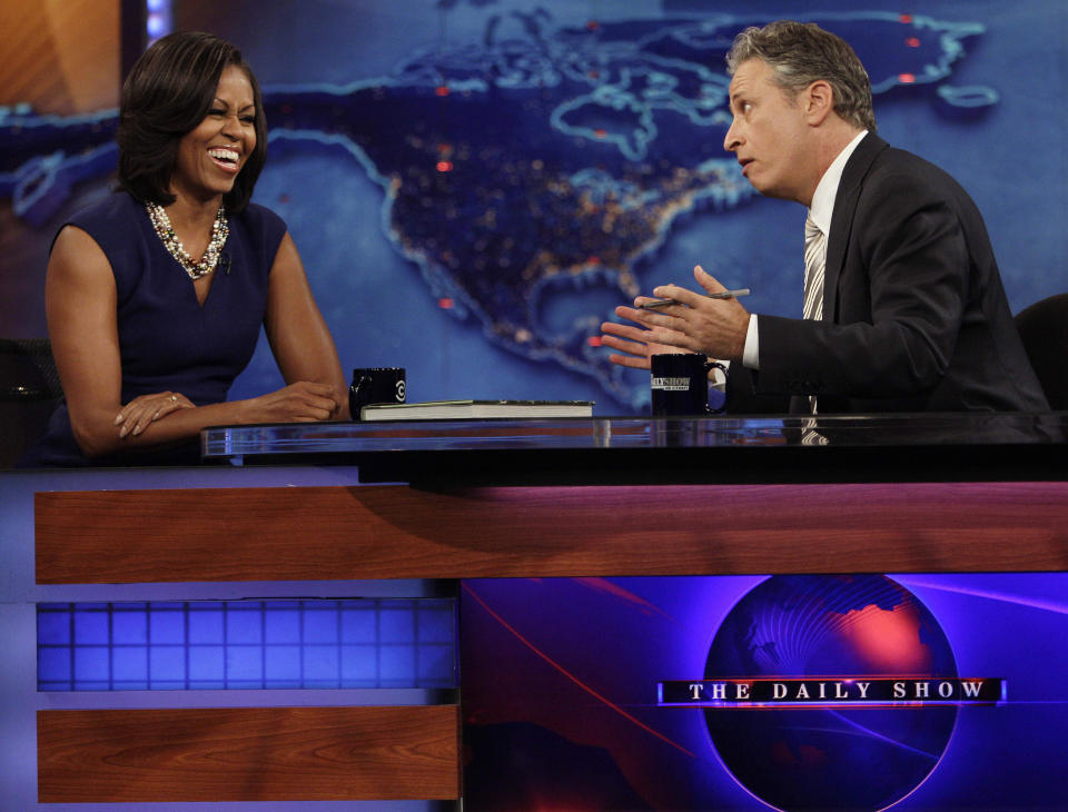 First lady Michelle Obama reacts to host Jon Stewart during a taping of "The Daily Show with Jon Stewart" Tuesday, May 29, 2012, in New York. (AP Photo/Frank Franklin II)