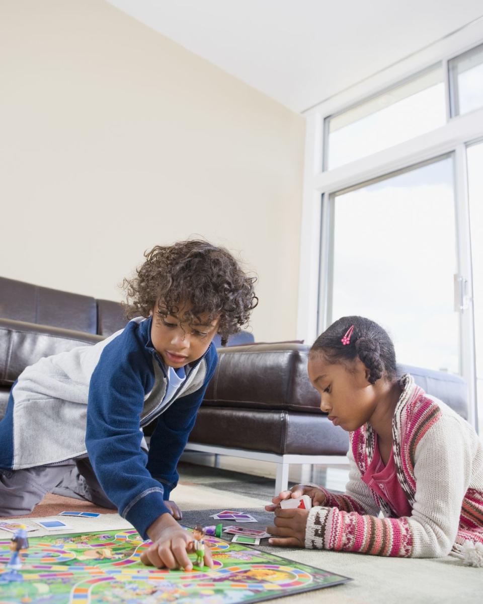 african american siblings playing board game fun activities for kids