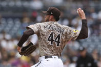 San Diego Padres starting pitcher Joe Musgrove winds up in the first inning of a baseball game against the Atlanta Braves, Sunday, Sept. 26, 2021, in San Diego. (AP Photo/Derrick Tuskan)