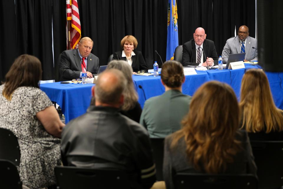 Oklahoma Pardon and Parole Board members listen to the family of Barry Alan Van Treese at Wednesday's clemency hearing for Richard Glossip.