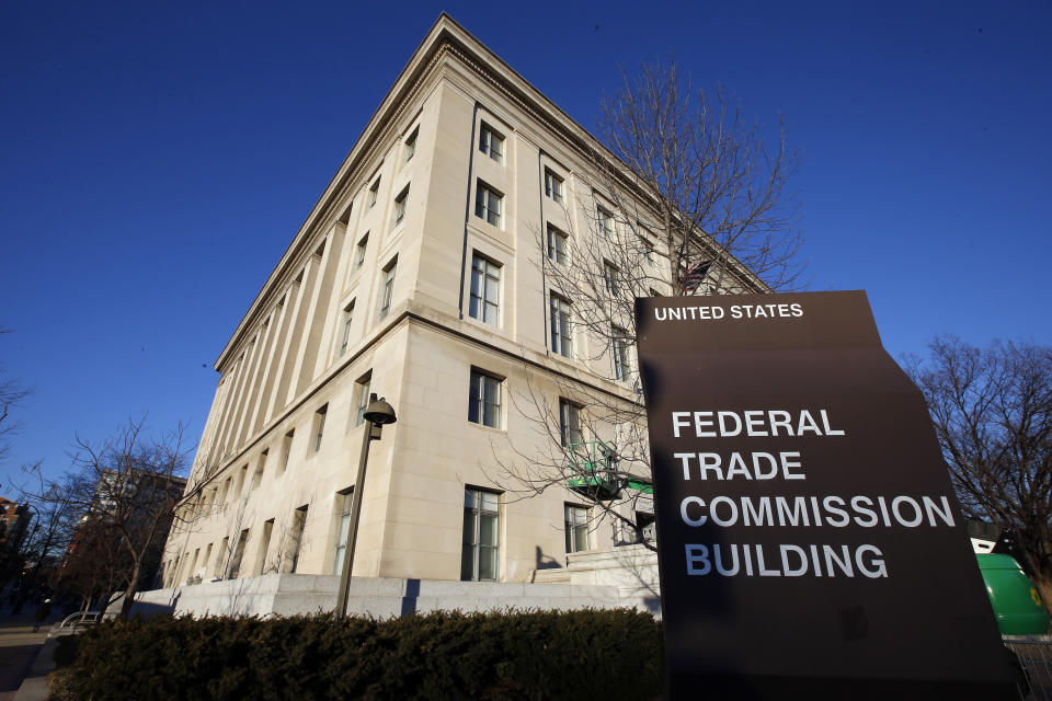 FILE - A sign stands outside the Federal Trade Commission building, Jan. 28, 2015, in Washington. Dark patterns may sound like a feature of sketchy websites, but these manipulative practices are a common way mainstream companies dupe people into sacrificing their privacy or paying for stuff they don’t really want. The Federal Trade Commission issued a report last year on the rise of dark patterns and since then has taken action against several companies, including online retailer Amazon and Epic Games, which makes the Fortnite video game. (AP Photo/Alex Brandon, File)