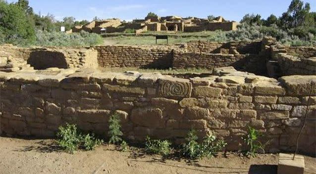 Far View Village lies on a ridgeline that decreases in elevation from north to south, and includes Far View House (shown in background), Pipe Shrine House (shown in foreground), Far View Tower, Mummy Lake and other buildings. Photo: Benson et al.