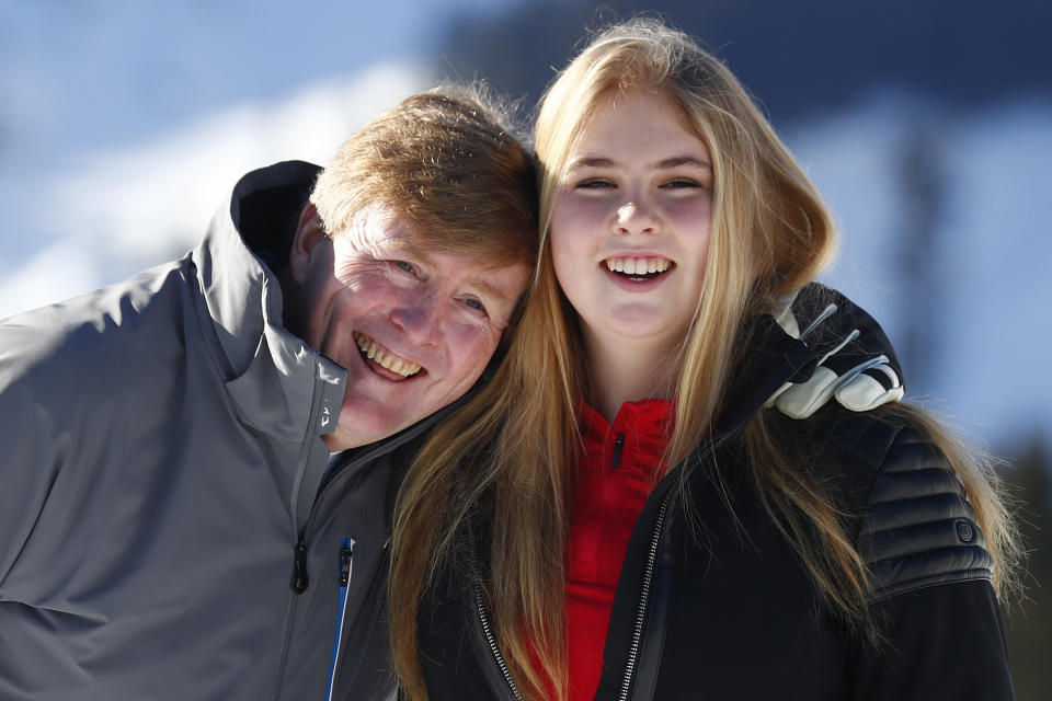 FILE - King Willem-Alexander of the Netherlands and his daughter Princess Amalia pose during a photo session in the Austrian skiing resort of Lech, Austria, Monday, Feb. 25, 2019. People in the Netherlands could get to know their future queen a little better Tuesday, with the publication of an officially authorized book about Princess Amalia appearing weeks before her 18th birthday. (AP Photo/Matthias Schrader, File)