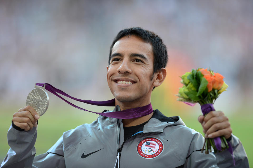 US silver medalist U.S. runner <a href="http://sports.yahoo.com/olympics/track-field/leonel-manzano-1130468/" data-ylk="slk:Leonel Manzano;elm:context_link;itc:0;sec:content-canvas" class="link ">Leonel Manzano</a> celebrates on the podium of the men's 1500m at the athletics event of the London 2012 Olympic Games on August 8, 2012 in London. (JOHANNES EISELE/AFP/Getty Images)