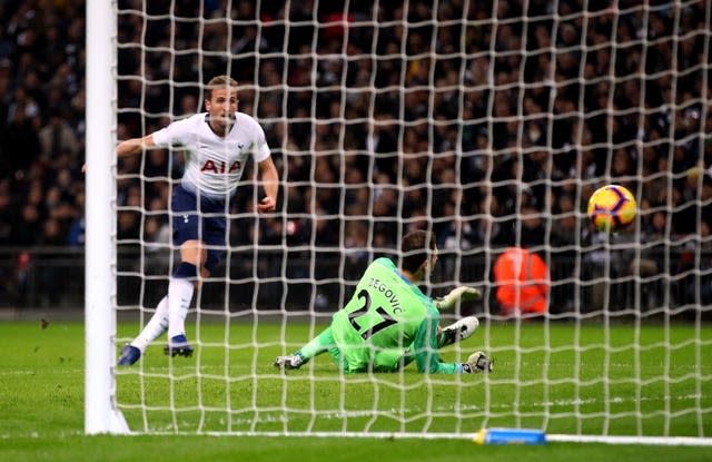 Harry Kane, left, scores against Bournemouth on Boxing Day 2018