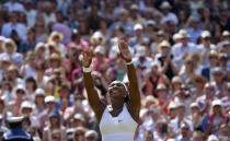 Serena Williams of the U.S.A celebrates after winning her Women's Final match against Garbine Muguruza of Spain at the Wimbledon Tennis Championships in London, July 11, 2015. REUTERS/Toby Melville