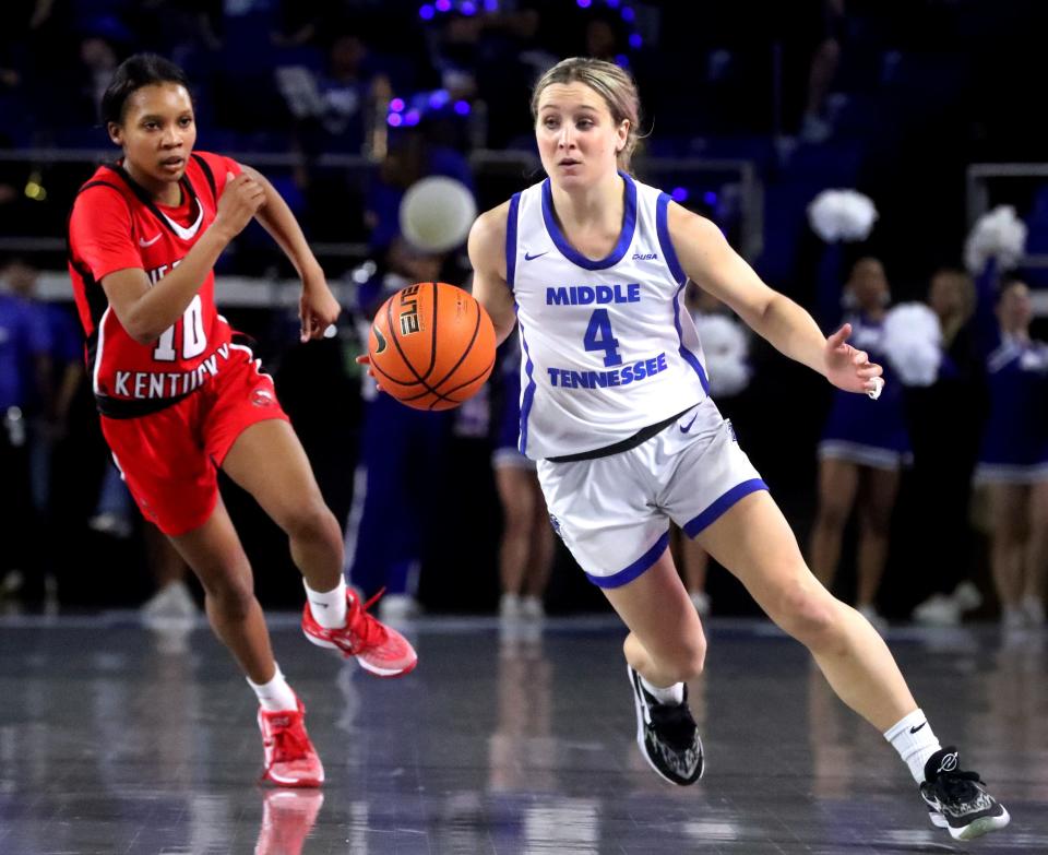 Middle Tennessee guard Savannah Wheeler (4) brings the ball down the court as Western Kentucky guard Acacia Hayes (10) defends during the women’s basketball game in Murphy Center at MTSU on Saturday, Feb. 3, 2024.