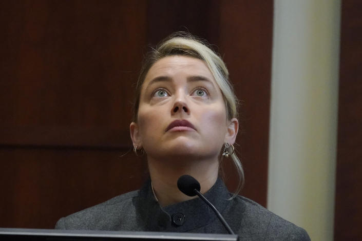 Actor Amber Heard testifies in the courtroom at the Fairfax County Circuit Courthouse in Fairfax, Va., Monday, May 16, 2022. Actor Johnny Depp sued his ex-wife Amber Heard for libel in Fairfax County Circuit Court after she wrote an op-ed piece in The Washington Post in 2018 referring to herself as a "public figure representing domestic abuse." (AP Photo/Steve Helber, Pool)