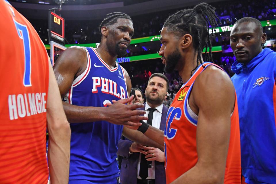 Apr 2, 2024; Philadelphia, Pennsylvania, USA; Philadelphia 76ers center Joel Embiid (21) and Oklahoma City Thunder guard Isaiah Joe (11) meet on court after 76ers win at Wells Fargo Center. Mandatory Credit: Eric Hartline-USA TODAY Sports ORG XMIT: IMAGN-719340 ORIG FILE ID: 20240402_eh_se7_01024.JPG