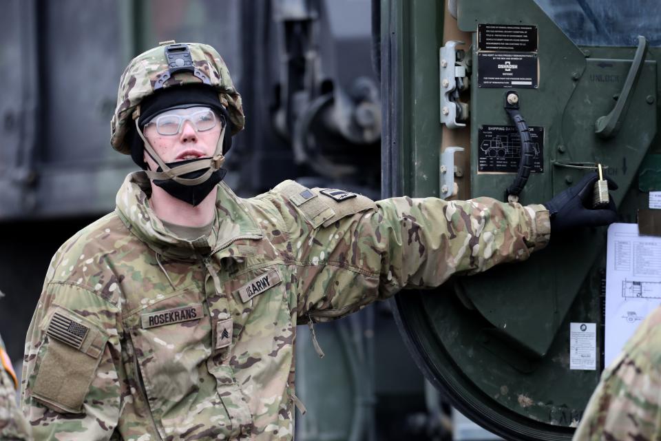 A soldier of 2nd Squadron, 2nd Cavalry Regiment of the U.S. Army is pictured preparing armored combat vehicles before deploying to Romania on Feb. 9, 2022, in Vilseck, Germany. The troops will join other US troops already there as part of a coordinated deployment of NATO forces across eastern Europe.