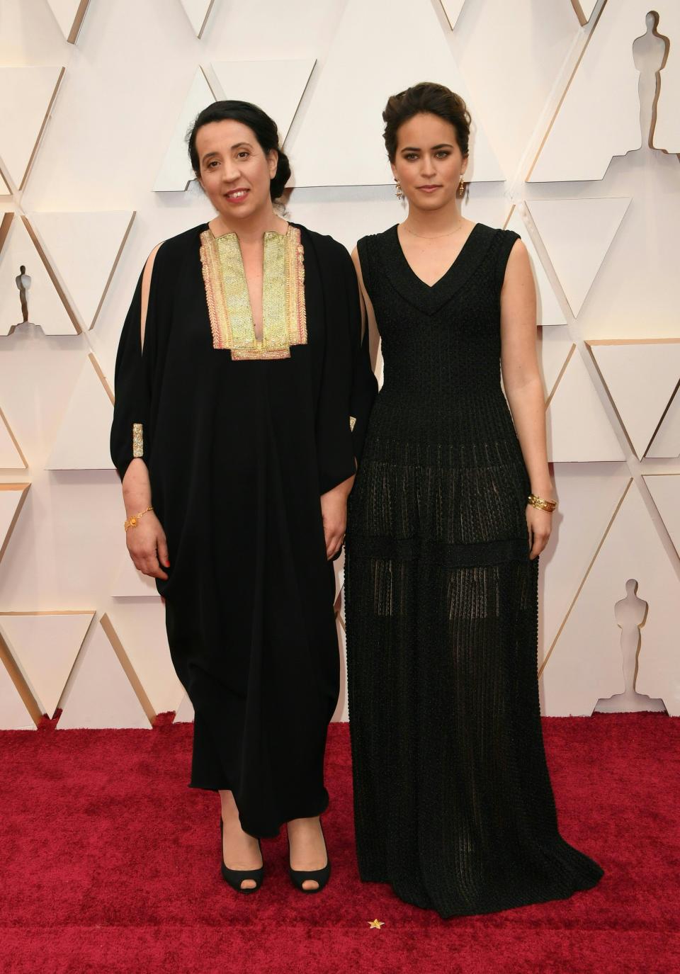 Nominee for "Brotherhood" Meryam Joobeur and a guest arrive for the 92nd Oscars at the Dolby Theatre in Hollywood, California on February 9, 2020. (Photo by Robyn Beck / AFP) (Photo by ROBYN BECK/AFP via Getty Images)
