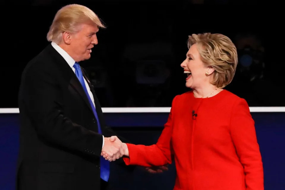 Donald Trump and Hillary Clinton shaking hands at a presidential debate in 2016. Despite the brief pleasantries, both are bitter political rivals. AP