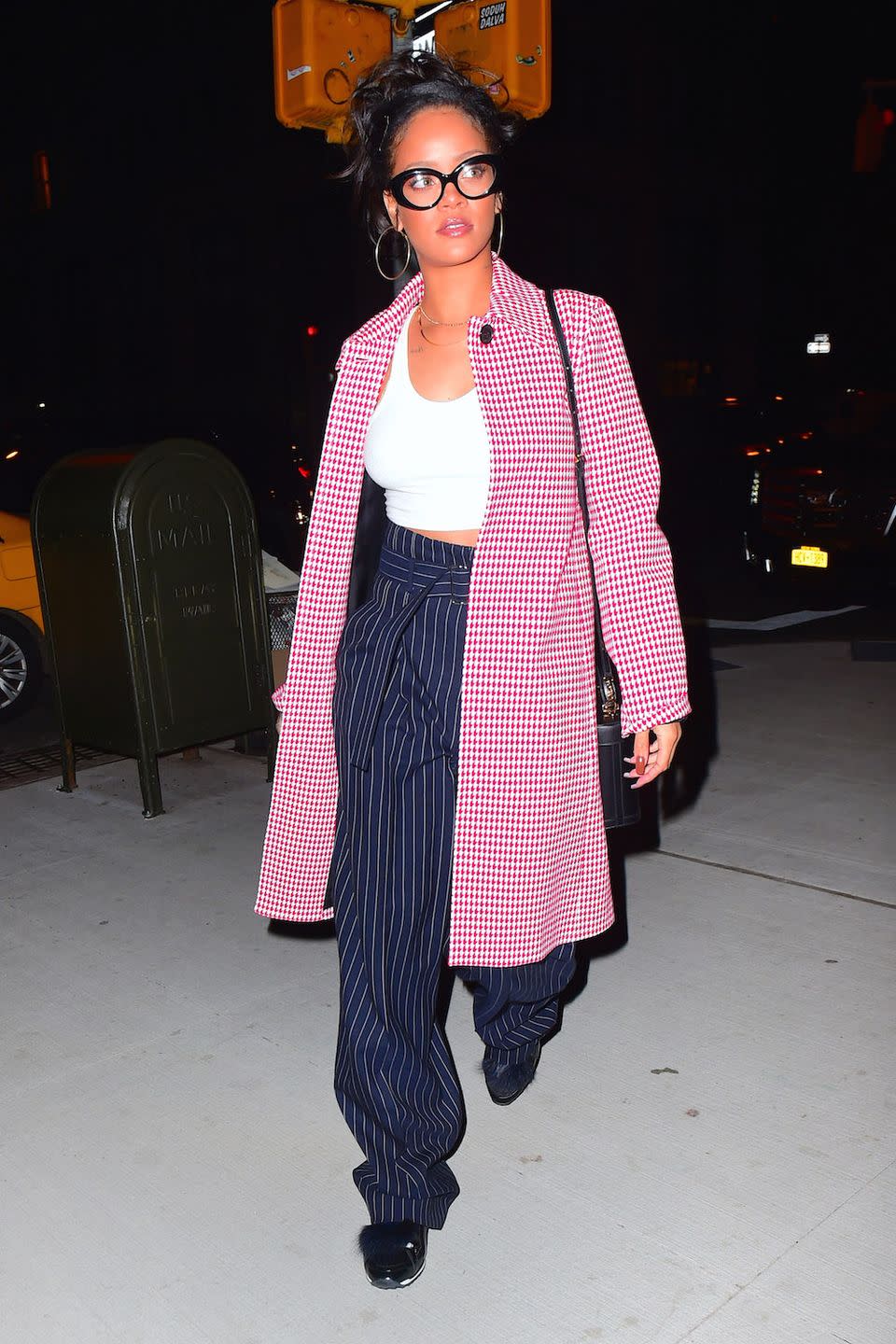 <p>Out to dinner in NYC in a red checkered coat over a cropped tank top, pinstriped trousers and sneakers, all tied together with nerd-chic oversized specs</p>