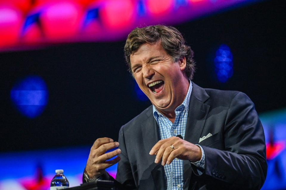Tucker Carlson addresses the Turning Point Action Conference in Florida on 15 July. (AFP via Getty Images)