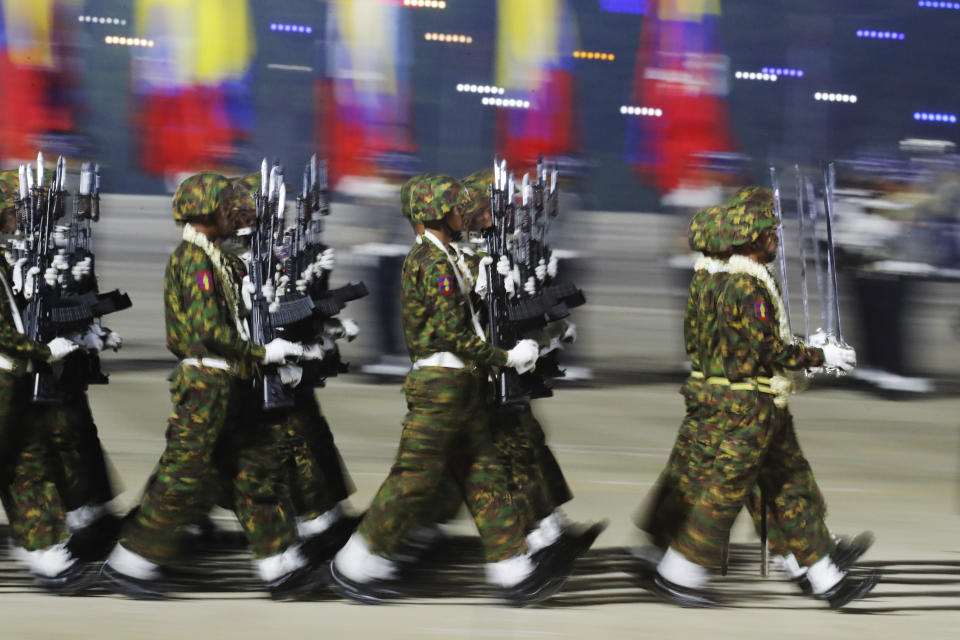 Myanmar military officers march during a parade to commemorate Myanmar's 79th Armed Forces Day, in Naypyitaw, Myanmar, Wednesday, March 27, 2024. (AP Photo/Aung Shine Oo)