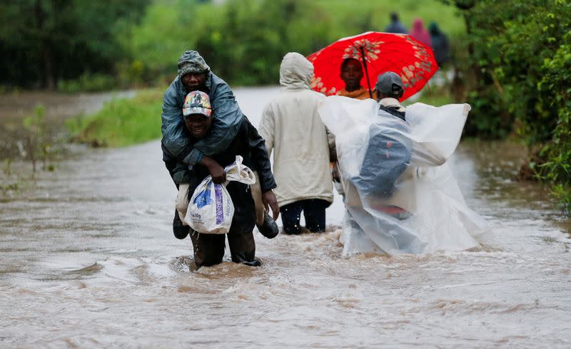 Residents affected after a seasonal river burst its banks following heavy rainfall in Kitengela municipality of Kajiado County