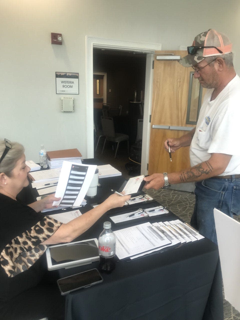 Administrative Assistant Mandy Hughes gives instruction to an applicant during the job fair Monday hosted by Barnett Southern in Pooler.