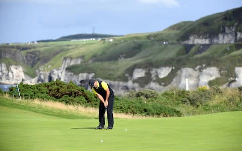 Patrick Reed of the US plays a putt on the first day of the British Open Golf Championship - Credit: REX