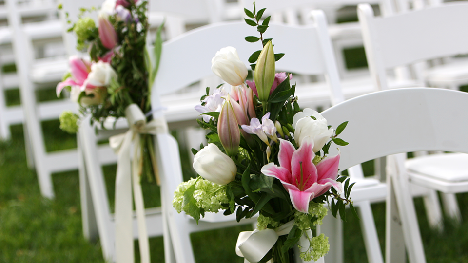 Image of wedding set up seats next to aisle represent 10,000 guests expected to attend New York wedding