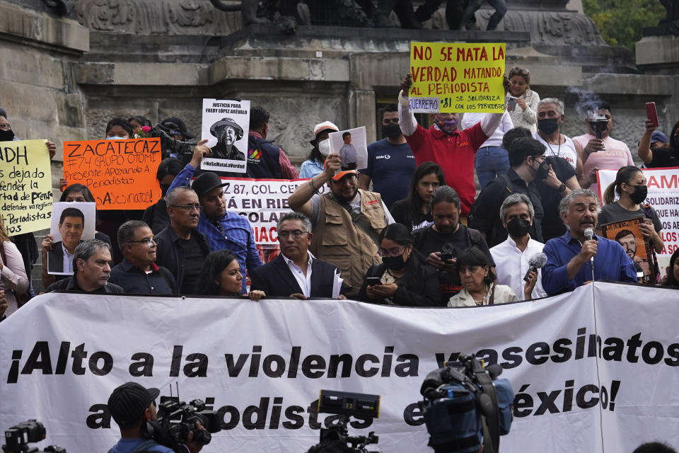 Journalists protest to draw attention to the latest wave of journalist killings, at the Angel of Independence monument in Mexico City, Monday, May 9, 2022. Two journalists Yessenia Mollinedo Falconi and Sheila Johana García Olivera, director and reporter, respectively, of the online news site El Veraz in Cosoleacaque, were shot to death in the state of Veracruz, on the Gulf of Mexico coast, on Monday. (AP Photo/Marco Ugarte)