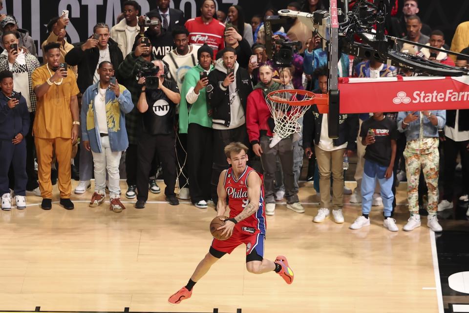 Mac McClung of the Philadelphia 76ers shoots during the slam dunk competition of the NBA basketball All-Star weekend Saturday, Feb. 18, 2023, in Salt Lake City. (AP Photo/Rob Gray)