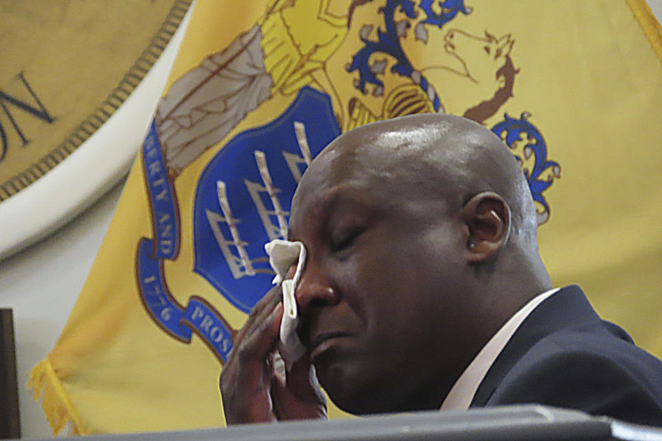 Newark, N.J. Assistant Public Safety Director Rufus Jackson wipes away tears during a hearing on Wednesday, Jan. 17, 2024, in Union N.J. into the July 5, 2023, fire in Newark that killed two city firefighters while Jackson was chief of the department. (AP Photo/Wayne Parry)