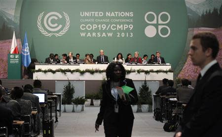 Delegates attend the closing session of the 19th conference of the United Nations Framework Convention on Climate Change (COP19) in Warsaw November 22, 2013. REUTERS/Kacper Pempel