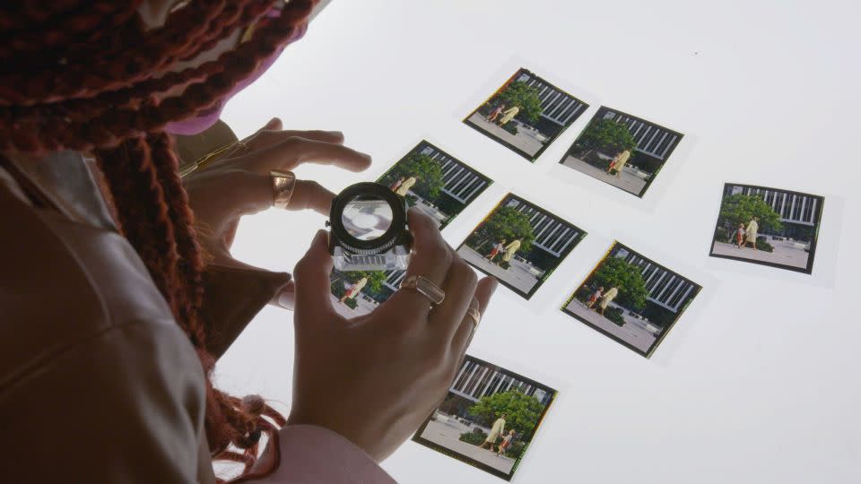 Director Jazmin Jones pores over old photographs in "Seeking Mavis Beacon," an investigation into the woman who became the face of software Mavis Beacon Teaches Typing. - Yeleen Cohen/Sundance Institute