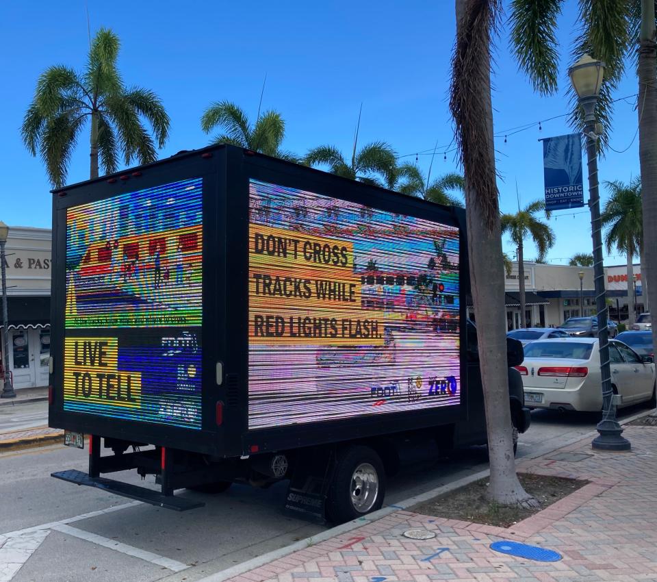 A truck with an illuminated train safety message on Sept. 20, 2023, was parked on Orange Avenue in downtown Fort Pierce just east of the railroad tracks.